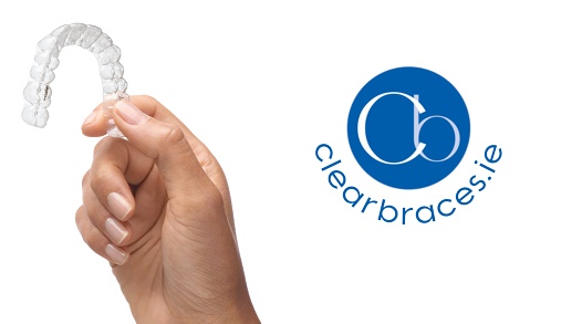clearbraces, hand holding invisalign retainer